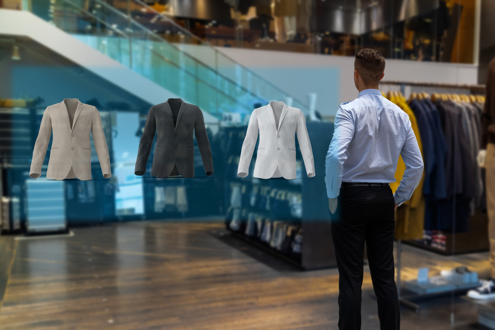 Photo de vestes de costumes avec un homme de dos